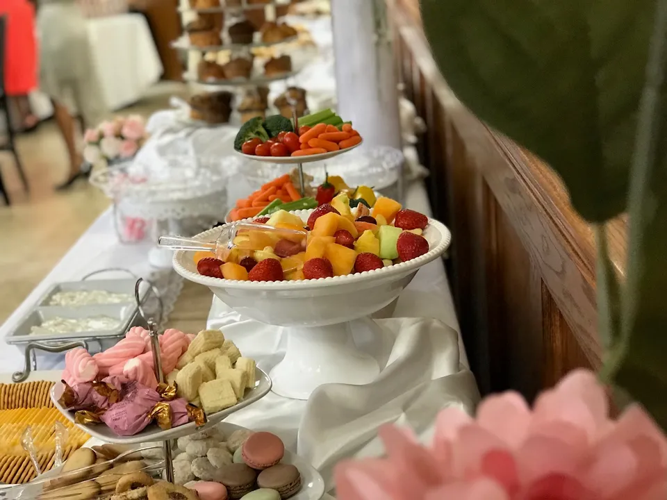 Grazing buffet with fruit, sweets and blush roses