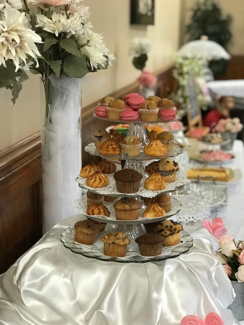 Close view of a tiered cupcake and macaron tower