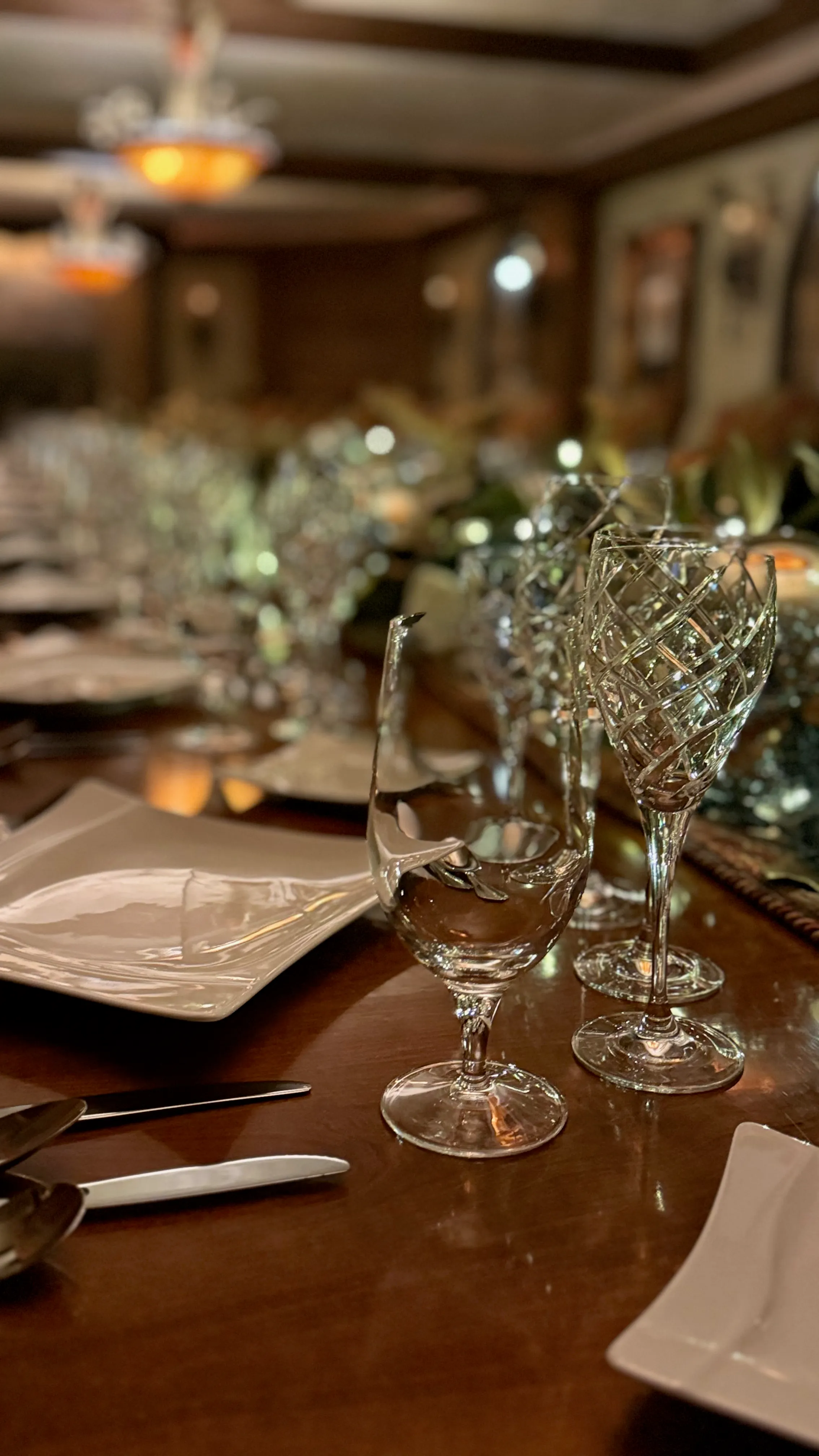 Crystal stemware detail at an intimate private dinner by Blush & Bash Event Co.