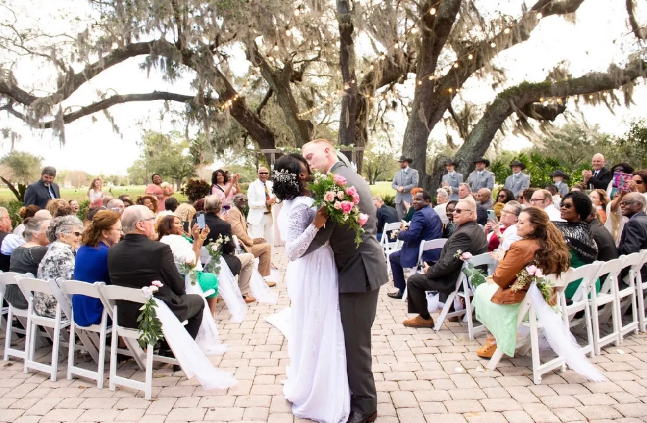Romantic wedding reception table setting with curated floral arrangements